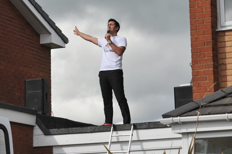 Teacher and singer Matt Ashton, literally singing from the roof tops as he entertains neighbours while raising funds for the NHS, singing from the roof of his garage in Aspull.