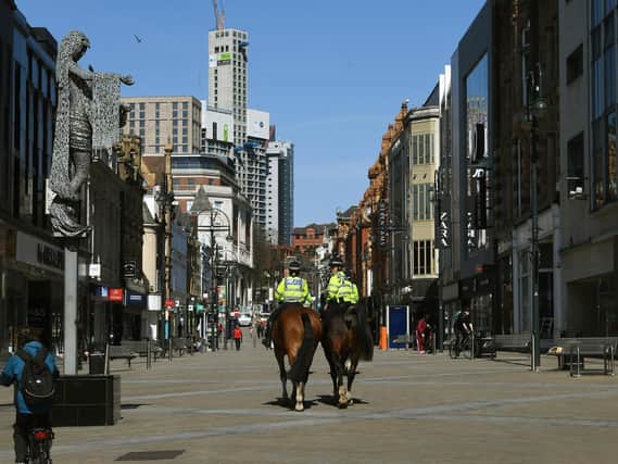 Police patrol Briggate on horses during the first lockdown