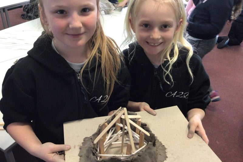 Evie and Darcie with their roundhouse model.