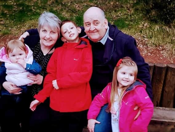 Keith Powell with his wife Denise and their grandchildren, Dillan, Mollie and Poppy