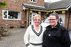 Rachael and mum Sue decorate house yellow on the Covid Day of Reflection