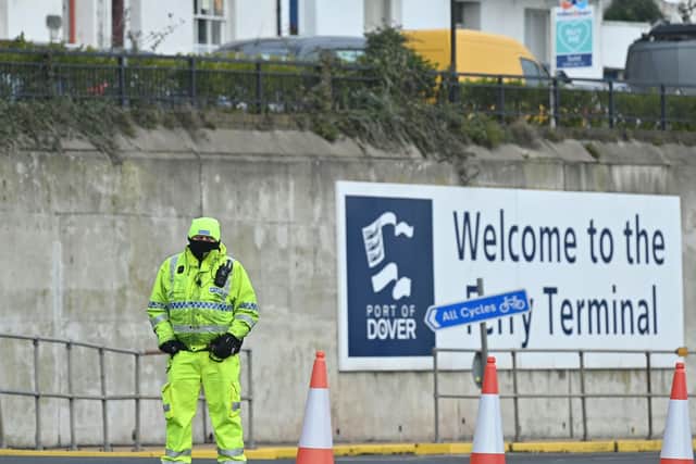 A police officers staffs the entrance to the Port of Dover, southeast England, on January 1, 2021 where they are checking that drivers have documentation showing a negative Covid-19 test