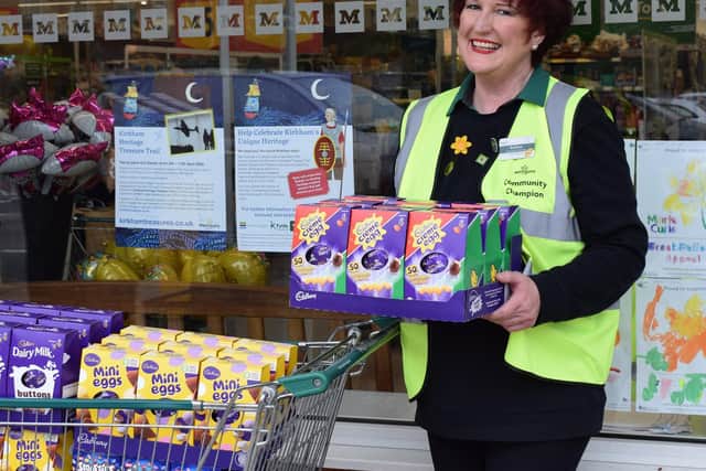 Barbara Parkinson from Morrisons with Easter eggs being offered as prizes