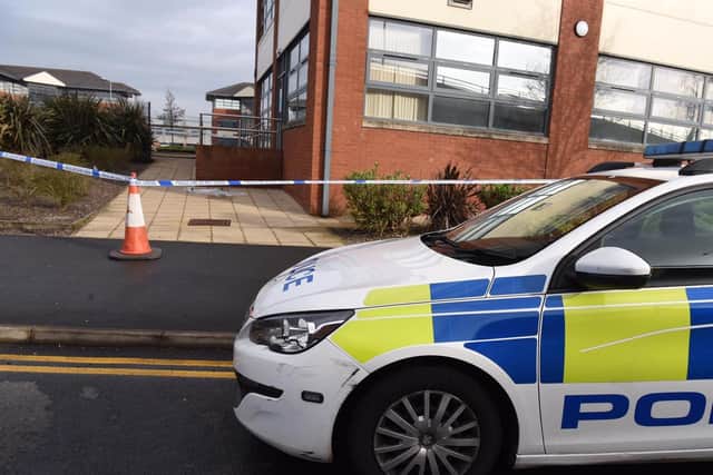 Police at the crime scene outside an NHS office building (West Strand House) in Marsh Lane this morning (Thursday, March 25)