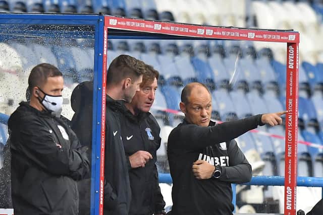 Paul Gallagher in the dugout with Steve Thompson and Alex Neil during PNE's 2-1 win at Huddersfield in October 2020