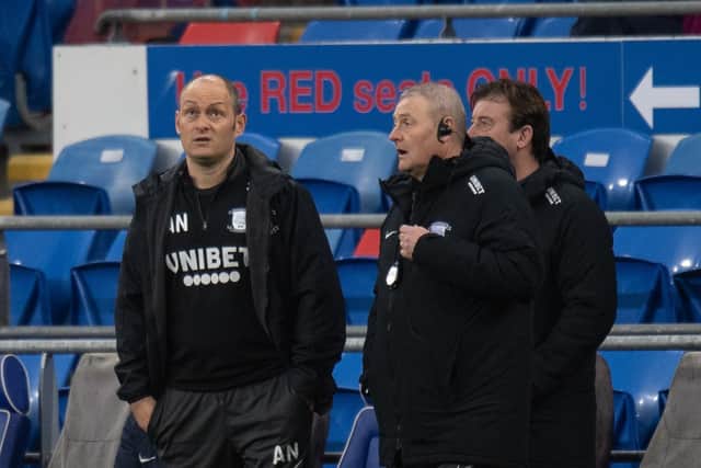 Frankie McAvoy and Alex Neil on the touchline during North End's defeat at Cardif in February