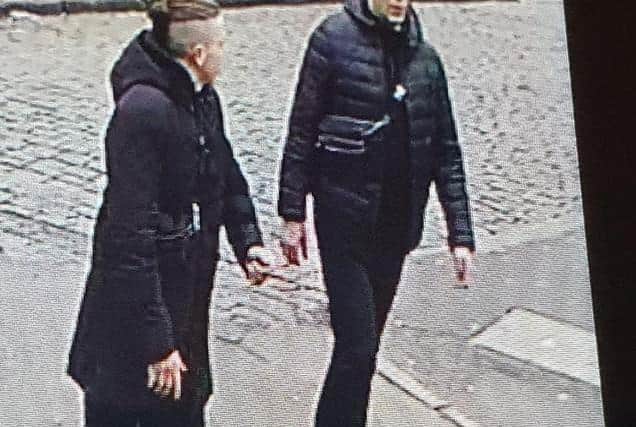Tautvydas Kaluina, who is believed to be the shorter man on the left with the distinctive hair, is pictured with a taller man, who is believed to be the man seen on previously released CCTV running into the Tesco superstore in Hill Street for help after Mr Kaluina was bundled into a car and abducted