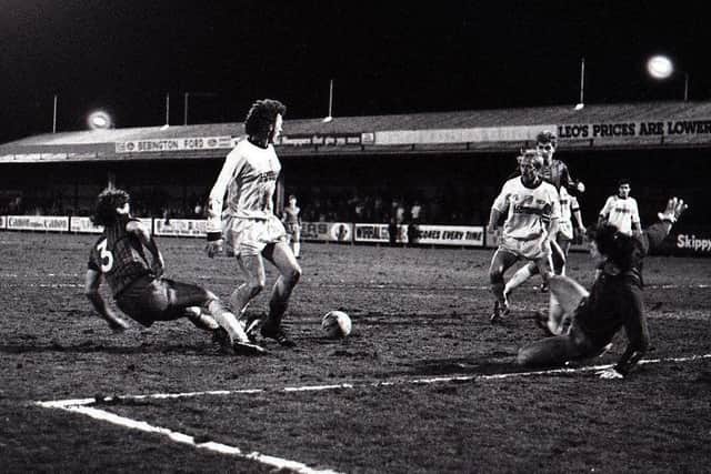 John Thomas is teed-up by Terry Gray to score for PNE at Tranmere