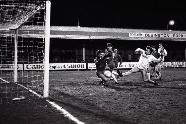 Preston North End striker John Thomas and Tranmere goalkeeper Nigel Adkins challenge in the box at Prenton Park in March 1986