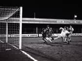 Preston North End striker John Thomas and Tranmere goalkeeper Nigel Adkins challenge in the box at Prenton Park in March 1986