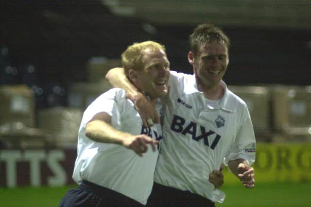 Rob Edwards (left) is congratulated by PNE team-mate Graham Alexander after finding the net against Norwich