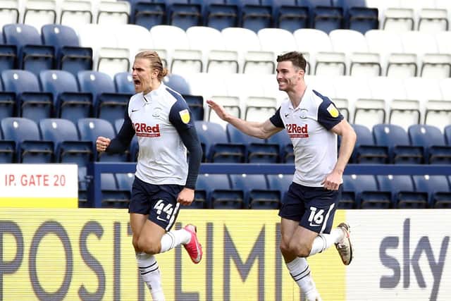 Brad Potts and Andrew Hughes celebrate Preston North End's late equaliser against Norwich City at Deepdale on Good Friday