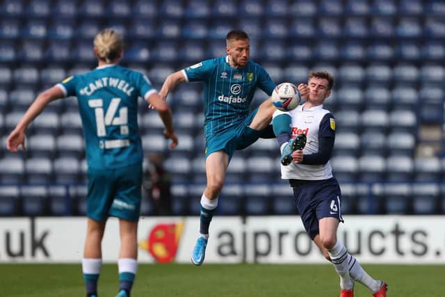 PNE defender Liam Lindsay puts in a challenge against Norwich