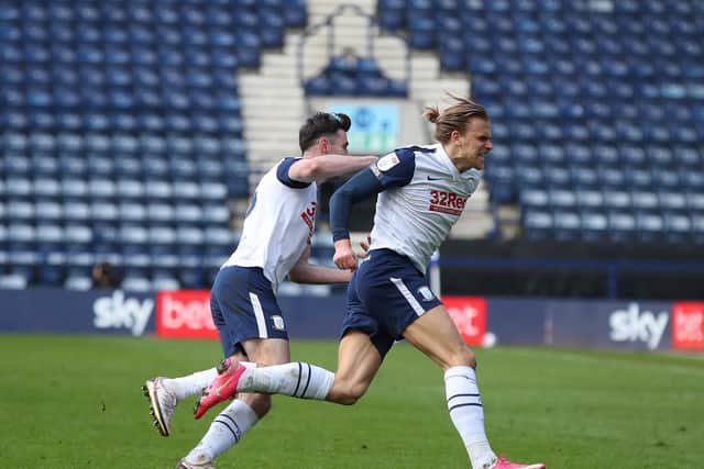 Preston North End goalscorer Brad Potts is pursued by Andrew Hughes as he runs to celebrate