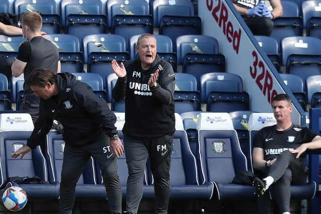 PNE interim head coach Frankie McAvoy with Steve Thompson and Mike Pollitt on the bench at Deepdale