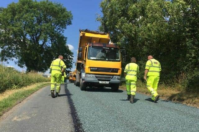 Surface dressing involves applying a top coat of loose chippings after having first reapired any potholes beneath - it is designed to prevent water getting into the lower levels of the road surface (image: Lancashire County Council)