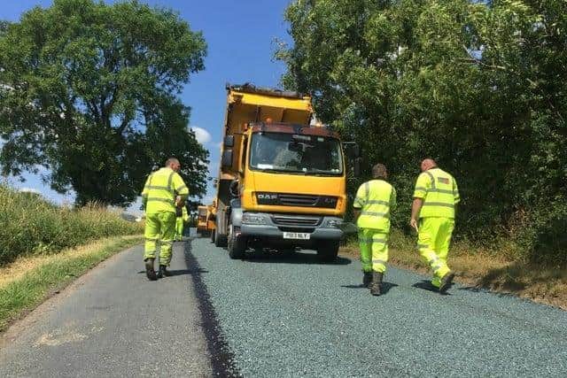 Surface dressing involves applying a top coat of loose chippings after having first reapired any potholes beneath - it is designed to prevent water getting into the lower levels of the road surface (image:  Lancashire County Council)