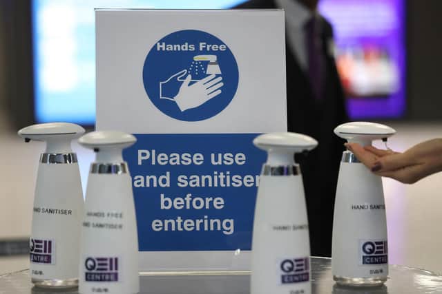 Hand sanitisers at the entrance to the QEII Centre in London.