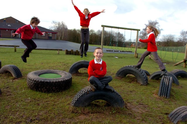 Jordan Hays, Jessica Eubank, Arron Deacon and Kaitlan MacLane play in the tyre park at Gillibrand Primary School, Chorley