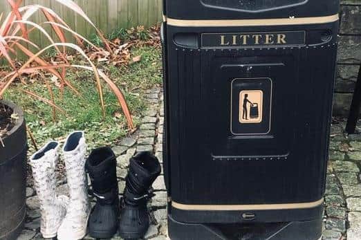 The unwanted footwear  dumped by Catterall parish Council's rubbish bin