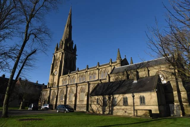 Grassed area at the rear of the Minster where the temporary cabin will stand.