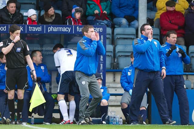 PNE's joint caretaker managers Graham Alexander and David Unsworth give instructions during the game at Rochdale in January 2012