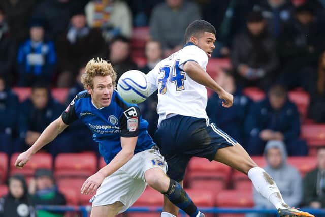 PNE loanee Jake Jervis challenges in the air against Rochdale