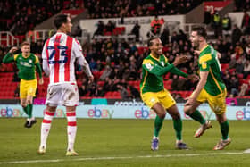 Andrew Hughes (right) celebrates his goal at Stoke on Monday