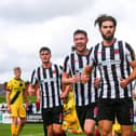 Lewis Baines, centre, celebrates a Chorley goal with Harry Cardwell, right, and Mike Calveley against Chester (photo:Stefan Willoughby)