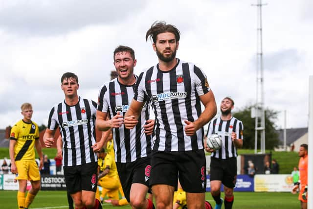 Lewis Baines, centre, celebrates a Chorley goal with Harry Cardwell, right, and Mike Calveley against Chester (photo:Stefan Willoughby)