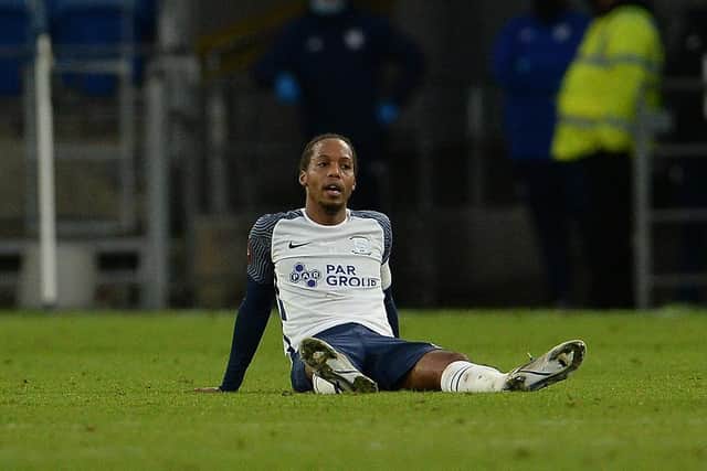 PNE midfielder Daniel Johnson goes down with cramp in extra-time against Cardiff City