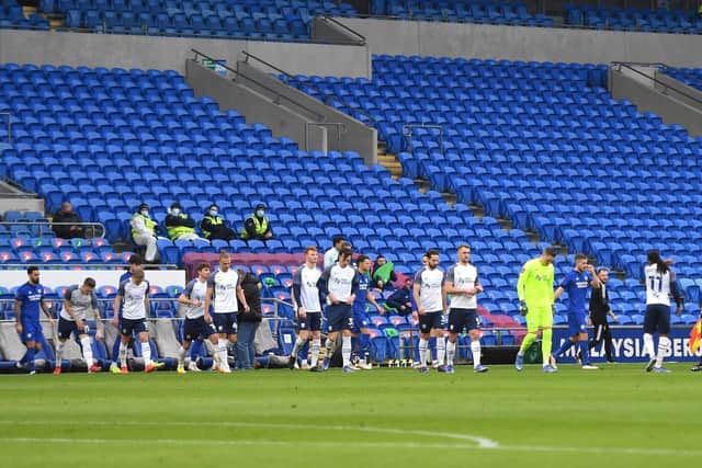 Preston North End's players take to the pitch at an empty Cardiff City Stadium on Sunday