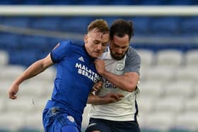 Preston North End defender Greg Cunningham challenges Cardiff’s Isaak Davies