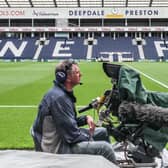 A television by the side of the pitch at Deepdale