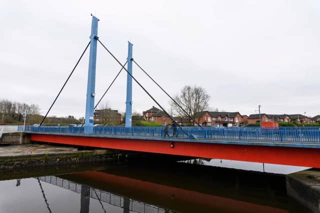The swing bridge moves around to allow boats into or out of the dock basin.