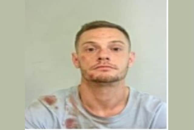 Police say Darryl Cooke, 31, is wanted in relation to allegations of assault and threats to kill. Pic: Lancashire Police