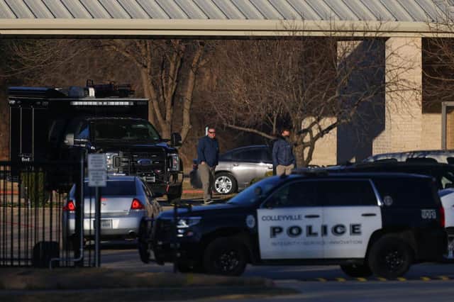 A Police car sits in front of the Congregation Beth Israel Synagogue in Colleyville, Texas, some 25 miles (40 kilometers) west of Dallas, on January 16, 2022.
