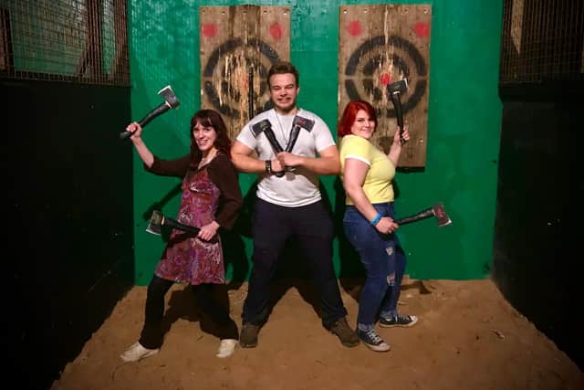 Punters getting ready for black axe throwing which was launched at Kanteena in Lancaster on Thursday.