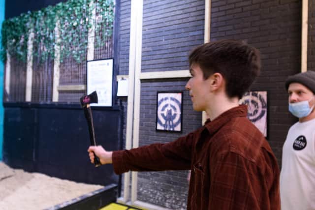 The first visitors throw axes at Black Axe Throwing Co at the Kanteena in Lancaster. Photo: Kelvin Stuttard