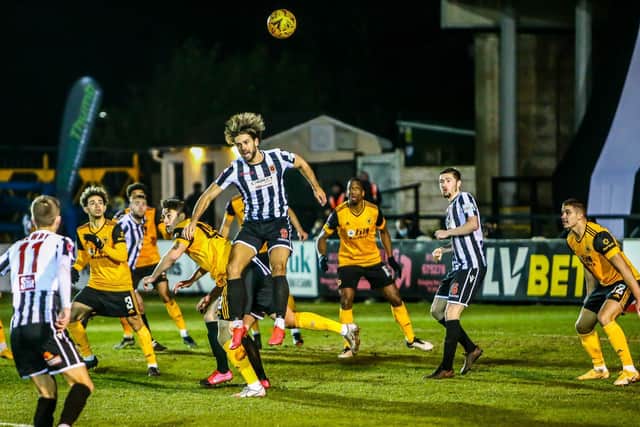 Harry Cardwell wins the ball in the air during Chorley's fourth-round FA Cup tie against Wolves at Victory Park (photo:Stefan Willoughby)