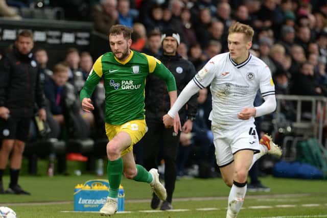 PNE wing-back Tom Barkhuizen takes on Swansea's Flynn Downes