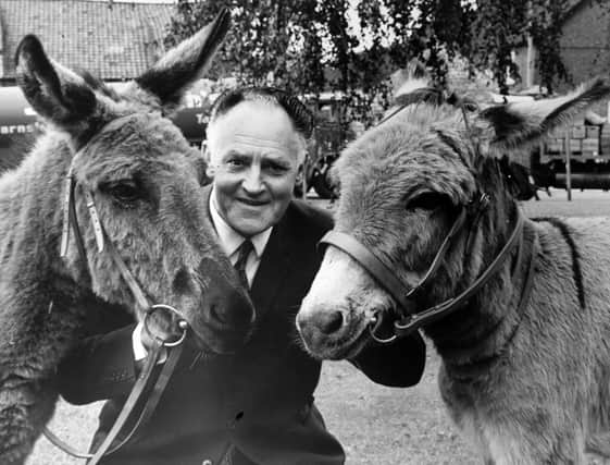 Tadcaster.  13th September 1972

Mr. Max Faircliffe is photographed with his surprise retirement present.

Mr. Faircliffe, aged 65, asked for a donkey as a gift when he retired after being brewery foreman at John Smith's Tadcaster Brewery, but when he arrived for the presentation he saw double.

Making the presentation, Mr. F. A. Riely-Smith, director, explained: "There was some money left over from Max's pals' contributions so we decided to add to it and give him another donkey as a companion for the first one."

Mr. Faircliffe, who is chairman of Tadcaster Rural Council, already keeps bantams, tropical fish, pigeons and a dog at his home, Stutton Lodge.