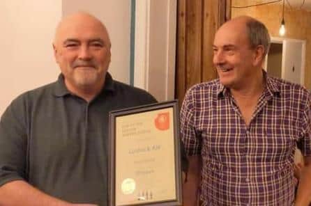 Lostock Ale owner Ray McLaughlin with his Best Pub of the Season award, with Adrian Smith, chairman of the North-West CAMRA branch.