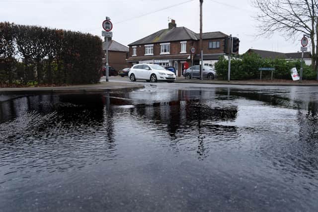 Water has been seeping out on Stanifield Lane for over a week - flooding the junction with Stanley Road and Centurion Way