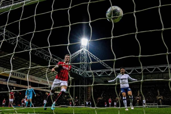 Callum Robinson watches a chip from Preston North End team-mate Alan Browne hit the back of the net against Bristol City at Deepdale in March 2018