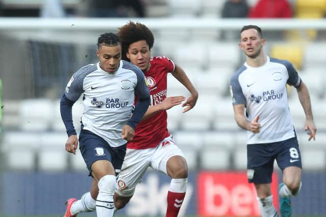 PNE striker Cameron Archer holds off Bristol City midfielder Han-Noah Massengo