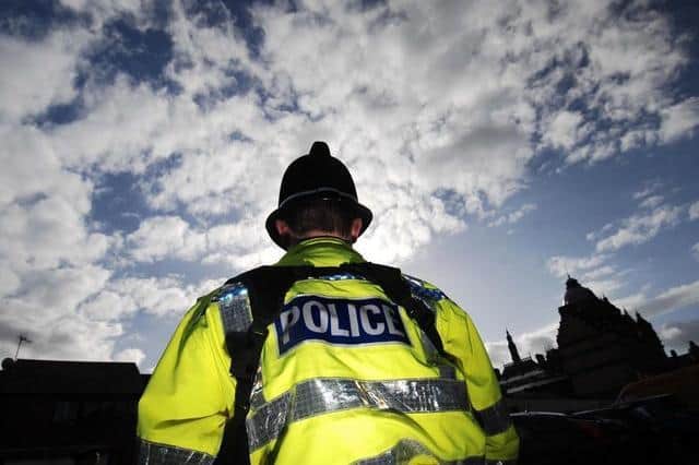 Police have launched an investigation after a group of men, wielding machetes and a handgun, broke into a house in Colne yesterday.
