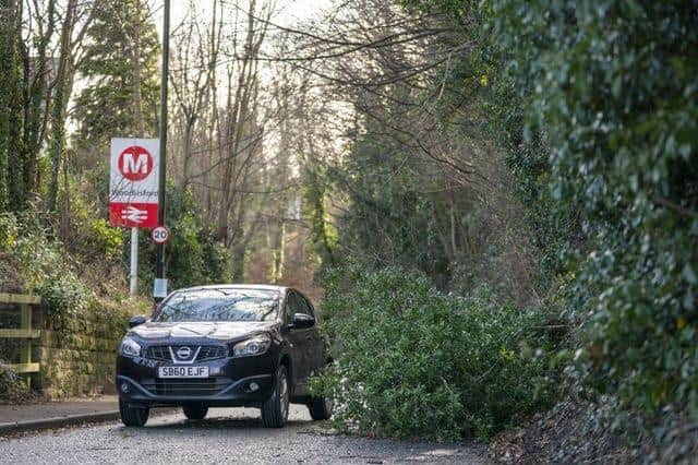 A fallen tree blocks a road in Woodlesford in West Yorkshire (Danny Lawson/PA)