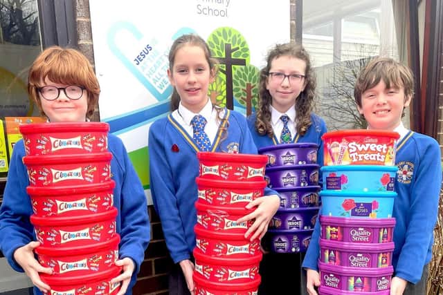 John, Lydia, Ffion and Oliver from St Peters Catholic Primary School in Lytham, with the plastic tubs collected for the Tub2Pub recycling scheme