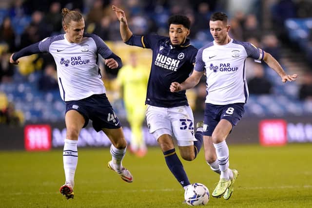 Millwall's Tyler Burey (centre) battles for the ball with North End's Alan Browne (right) and Brad Potts